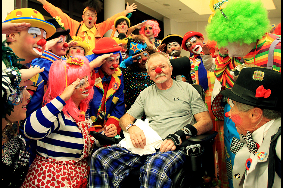 Vietnam Veteran Carl Arnold, 63, centre, gets a salute from a group of