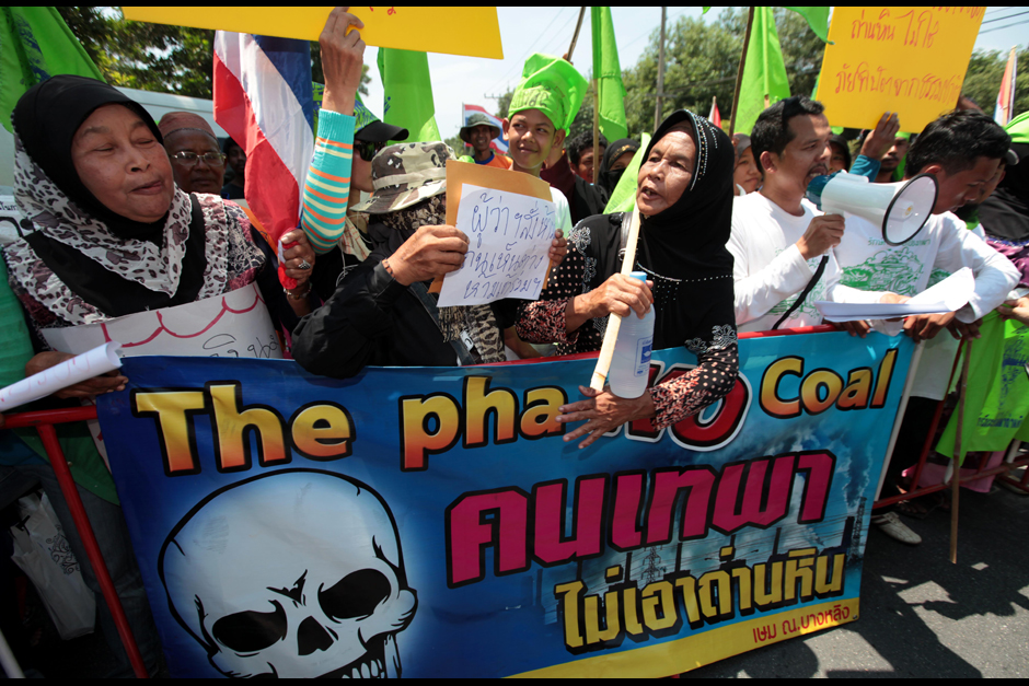 Protesters gather outside a public hearing on a planned coal-fired power plant in Songkhla's Thepha district. Local people worry the Egat plant and associated coal delivery port would pollute the environment. - Chanat Katanyu