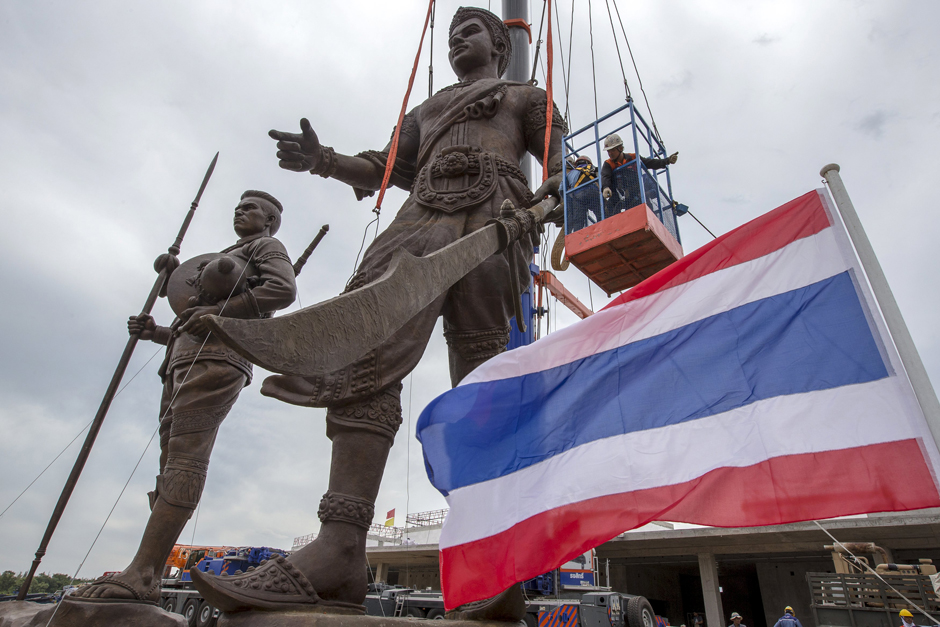 Labourers work on a giant bronze statues of former King Naresuan (left) and King Ram Khamhaeng (centre) at Ratchapakdi Park in Hua Hin, Prachuap Khiri Khan province. The park is being constructed by the Thai army to honour past Thai monarchs and is situated on an army compound near the Klai Kangwon Palace. The project is estimated to cost about 700 million baht ($20,073,991). - Reuters