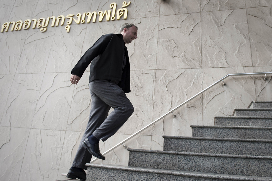 British labour rights activist Andy Hall, 34, arrives at the Southern Criminal Court in Bangkok. The court indicted Mr Hall in a case linked to a report he co-authored alleging severe labour abuses in Thailand's food industry, a key supplier to Western supermarkets. - AFP