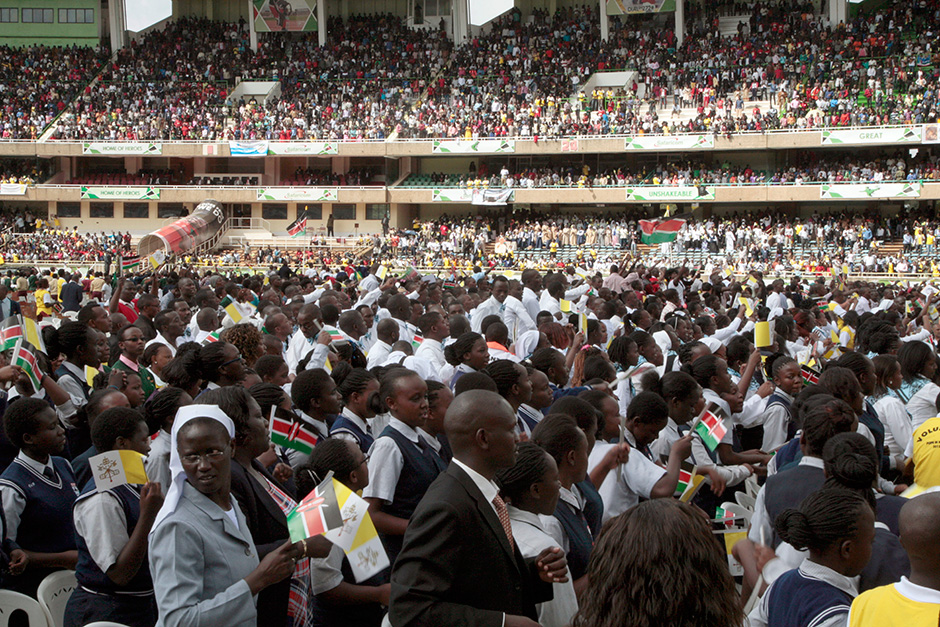 People gather at the Kasarani Stadium to see Pope Francis, in Nairobi, Kenya. Pope Francis denounced the conditions slum-dwellers are forced to live in during a visit to one of Nairobi's many shantytowns. — AP