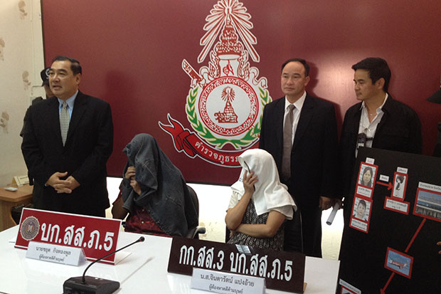 Suspects in a sex-trafficking ring targeting Chiang Mai women are brought to a police press conference Wednesday. (Photo by Cheewin Sattha)