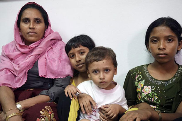 Rohingya migrants from Myanmar and Bangladesh look on as they were detained at the immigration office in Phangnga province on Friday. (EPA photo)