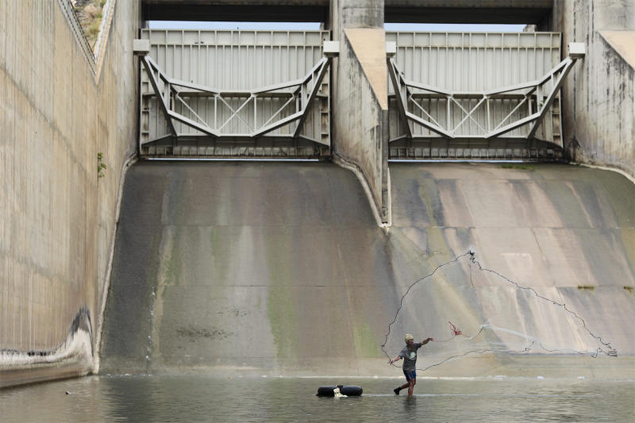 Cast away: A villager tries his luck in the murky, shallow water of the Pasak Chonlasit dam in Lop Buri. Almost no water can be discharged as the dam’s reservoir holds just 9.5% of its capacity. While Bangkok residents contend with flooding, farmers in the Central region have been told to delay their rice crops due to water shortages.