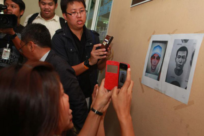 Bangkok Post - Arrest warrants for two suspects in café owner killing