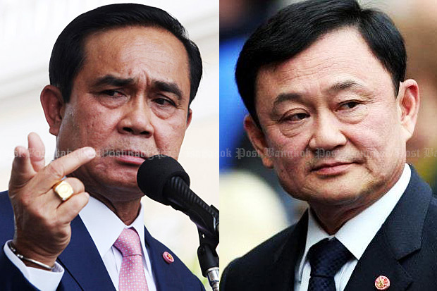 Prime Minister Prayut Chan-o-cha says in a press conference at Government House on Thursday that he had signed a paper to strip the police rank from Thaksin Shinawatra. (Photo by Thiti Wannamontha)