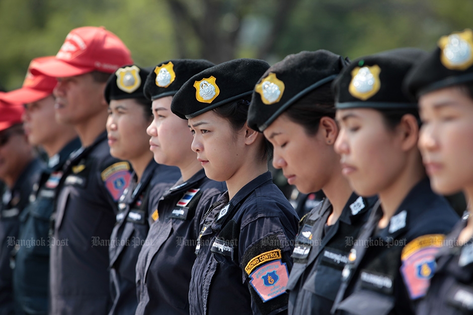 Female police officers join their male colleagues as the Royal Thai Police Office kicked off a campaign against crimes during the Songkran holidays at Sanam Luang. — Chanat Katanyu