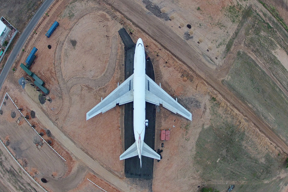 Workers assemble an old Boeing 747 in Nakhon Ratchasima on May 7. A businessman plans to turn a cassava farm into a new tourist attraction in this northeastern province. Under the 'Boeing Land' project, there will be restaurants and coffee shops inside and around the old plane to draw visitors. - Pattarapong Chatpattarasill