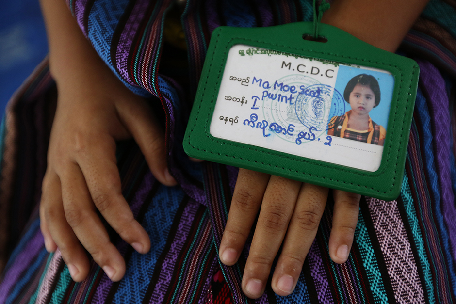 Children of Myanmar workers in Thailand get dressed up and wear makeup to greet Suu Kyi. - Seksan Rojjanametakun
