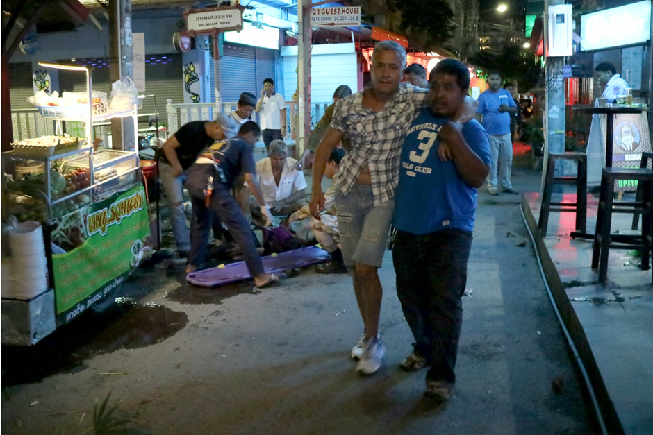 Bomb explosions outside a bar kill one woman and wound at least 19 people in Hua Hin. - Chaiwat Satyaem