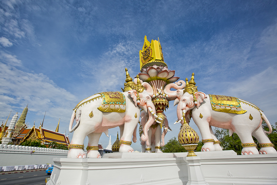A statue of two white elephants adorned with the royal emblem, near the Grand Palace in Bangkok, celebrates the 70th anniversary of His Majesty the King's accession to the throne on June 9. - Krit Phromsakla Na Sakolnakorn