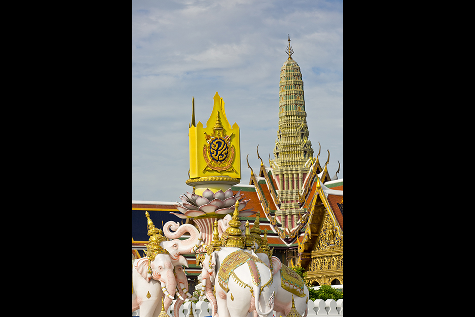 A statue of two white elephants adorned with the royal emblem, near the Grand Palace in Bangkok, celebrates the 70th anniversary of His Majesty the King's accession to the throne on June 9. - Krit Phromsakla Na Sakolnakorn