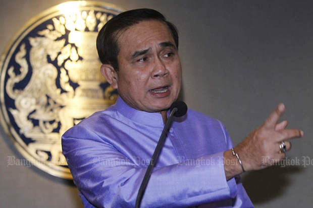 Prime Minister Prayut Chan-o-cha answers questions from reporters about the Pheu Thai calendar after a cabinet meeting on Tuesday. (Photo by Thanarak Khunton)