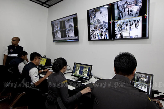 Immigration police in a control room at Suvarnabhumi airport monitor their screens as a passenger background check system known as the Advance Passenger Processing System was launched on Dec 1, 2015. (Photo by Krit Promsaka na Sakolnakorn)