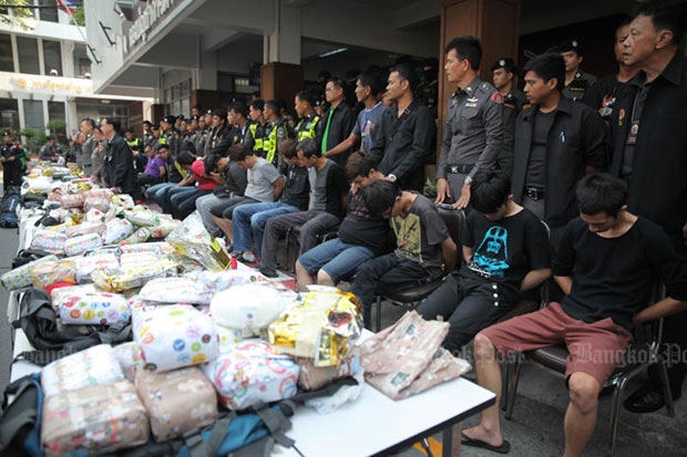 This 15-strong gang of Malaysian men shown at a media conference were arrested with a large amount of crystal methamphetamine and heroin on a South-bound expres train travelling from Bangkok to Butterworth in Malaysia. (Photo by Wichan Charoenkiatpakul)