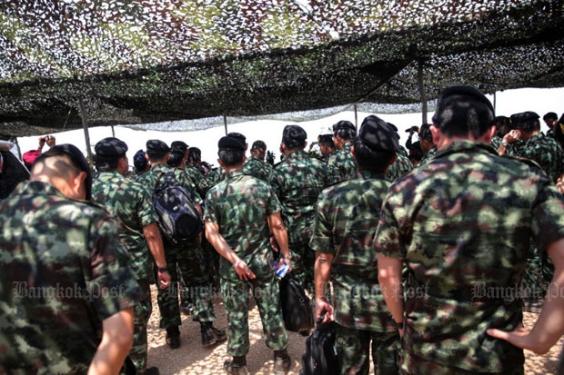 Prime Minister Prayut Chan-o-cha has empowered commissioned officers backed up by rank-and-file soldiers to act as crime suppression officers. (Photo by Wichan Charoenkiatpakul)