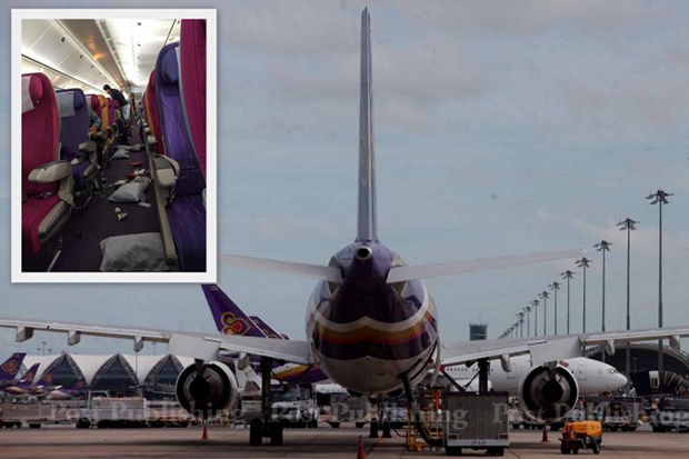 An inset shows the interior of the aircraft after air turbulence on Thai Airways International flight TG434, while the plane was en route from Jakarta to Bangkok on Monday. (Post Today/Kru P'Birth Facebook photos)