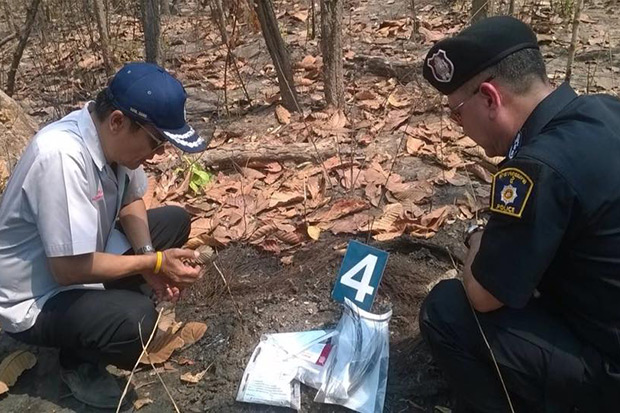 Authorities inspect human bones found in a forest in Udon Thani on Thursday. (Udon Thani governor Chayawut Chanthorn’s Facebook page)