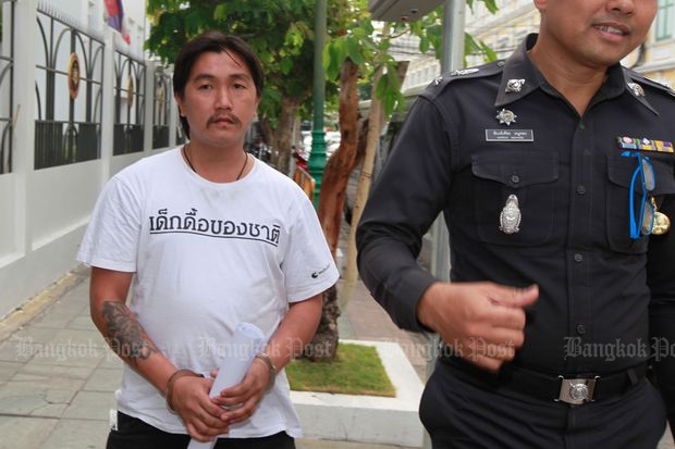 Protester charged with lese majeste