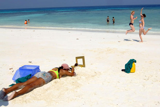 Tourists take photos on Koh Tachai in January 2015. (Bangkok Post file photo)