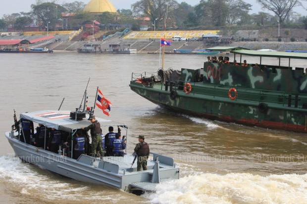 Boats from Thailand and Laos patrol the Mekong River river together as part of the Safe Mekong Joint Operation.