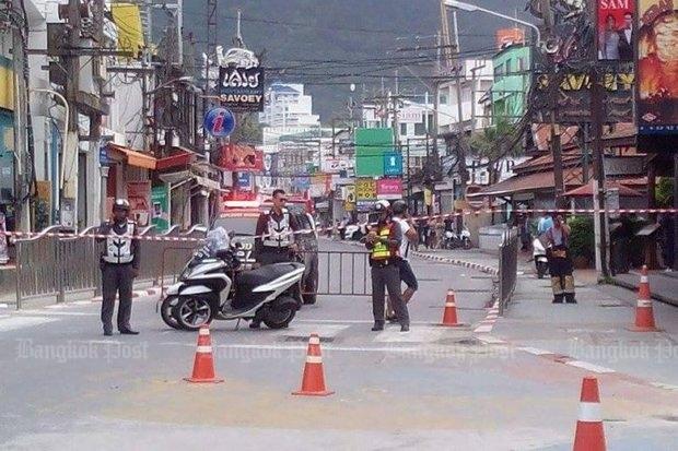 Police block a road near Patong Beach in Phuket following a bombing incident on Friday. (Photo by Achadtaya Chuenniran)