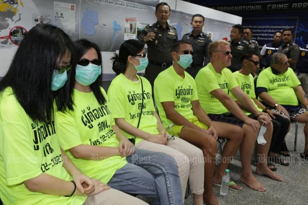 Pol Lt Gen Nathathorn Prousoontorn (centre), head of the Immigration Police Bureau (IPB) said the three Chinese women and four European men are wanted in their home countries. (Photo by Apichit Jinakul)