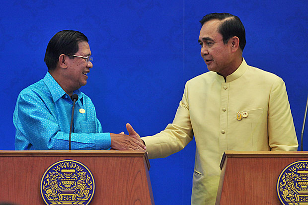 Cambodian Prime Minister Hun Sen and Thai Prime Minister Prayut Chan-o-cha shake hands before a ceremony at Government House in Bangkok last December. Photo by Thiti Wannamontha Cambodian Prime Minister Hun Sen and Thai Prime Minister Prayut Chan-o-cha shake hands before a ceremony at Government House in Bangkok last December. Photo by Thiti Wannamontha