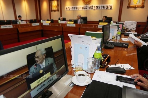 Meechai Ruchupan (on monitor screen and at head of table) and his Constitution Drafting Committee say they're almost finished with the organic laws, meaning they're almost finished with the new, improved constitution. (File photo) Meechai Ruchupan (on monitor screen and at head of table) and his Constitution Drafting Committee say they're almost finished with the organic laws, meaning they're almost finished with the new, improved constitution. (File photo)