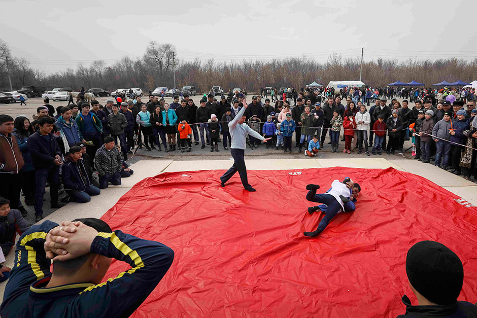 Young wrestlers compete during celebrations of Nauryz, an ancient holiday marking the spring equinox, in the village of Panfilovo in Kazakhstan. — Reuters