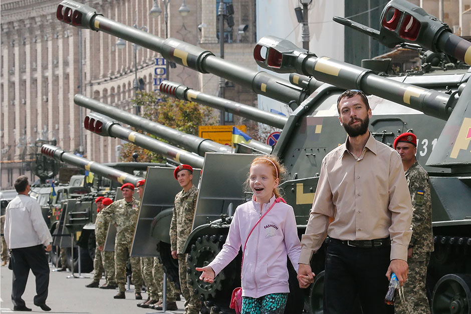 Ukrainians look at the military hardware displayed on the central street of Khreshchatyk in Kiev. A military parade dedicated to the Independence Day of Ukraine is scheduled for Aug 24. — EPA