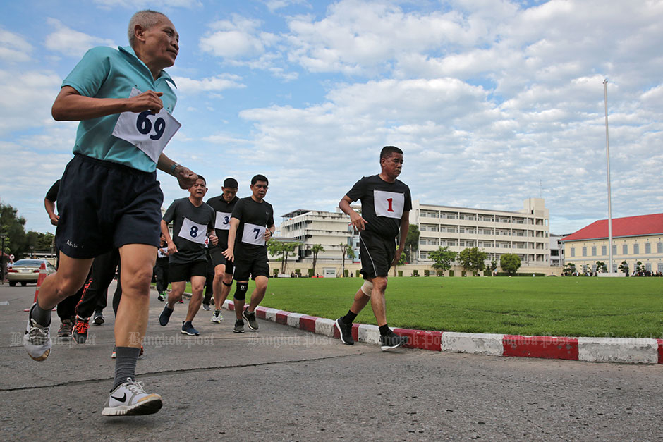 Army chief Gen Chalermchai Sitthisad (right) joins other high-ranking officers as they took part in an annual exercise at the Royal Thai Army headquarters. — Chanat Kantanyu