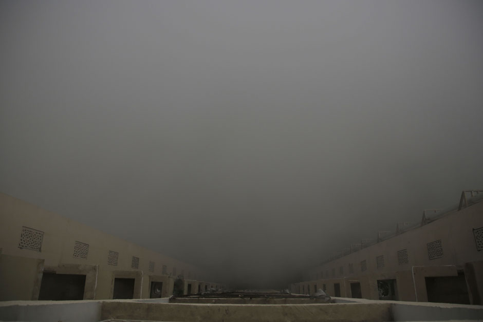 In this photograph taken from the 10th floor of a building, the ground is completely hidden by smog in New Delhi, India. A thick gray haze enveloped India's capital on Wednesday as air pollution hit hazardous levels. The Indian Medical Association said New Delhi was in the midst of a
