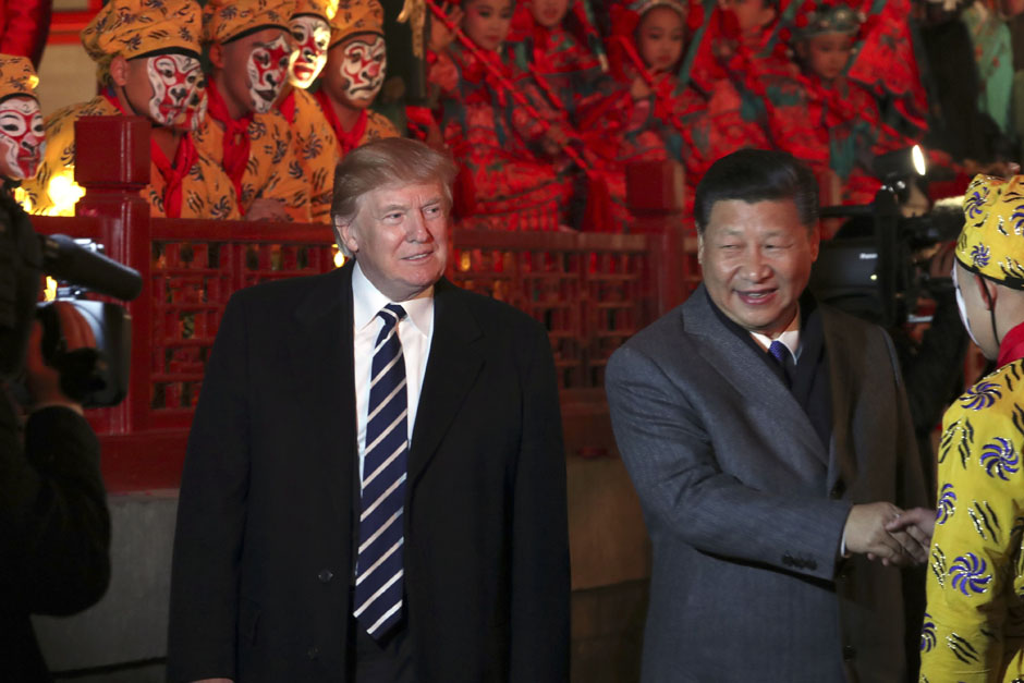 US President Donald Trump and Chinese President Xi Jinping, right, arrive to watch an opera performance at the Forbidden City in Beijing. Trump is on a five-country trip through Asia, travelling to Japan, South Korea, China, Vietnam and the Philippines. — AP