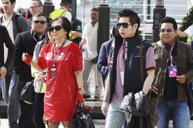 Vorayudh Yoovidhaya, mum Daranee and brother Varit (right) live it up as special guests at the 2013 British Grand Prix at Silverstone just months after Vorayudh's Ferrari crushed, dragged and killed a policeman. (Photo via AP)