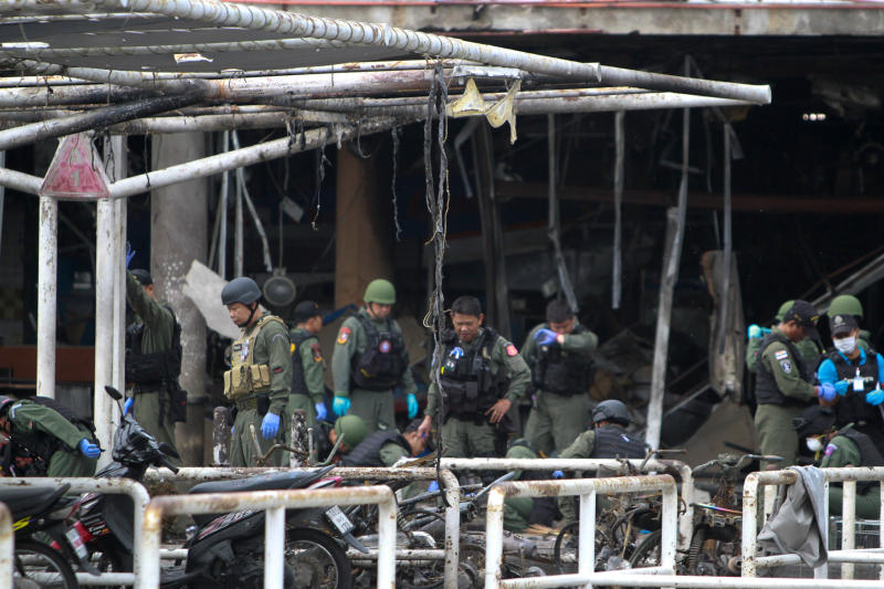 Military personnel inspect the site of a bomb attack at Big C Supercenter in Muang district, Pattani, on Wednesday. (Reuters photo)