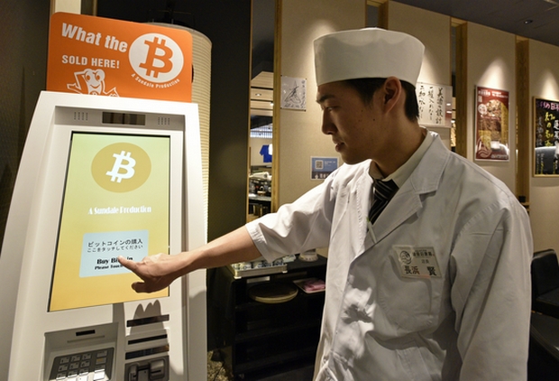 Ken Nagahama, manager of the Numazuko Ginza sushi restaurant, demonstrates the Bitcoin purchase system at his restaurant in central Tokyo. Bitcoin usage is becoming more widespread in Japan and numerous restaurants and stores are accepting payments with the digital currency. (EPA Photo)