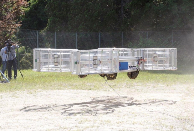 The Cartivator flying car model hovers above a former school ground in Toyota, Japan on Saturday. (AP Photo)