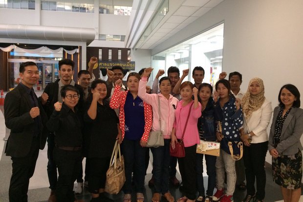 The 14 Myanmar workers, seen here at Wednesday's hearing at the Don Muang court, have vowed to fight criminal defamation charges filed by the owner of Thammakaset Farm 2. (Photo via Migrant Workers Rights Network) The 14 Myanmar workers, seen here at Wednesday's hearing at the Don Muang court, have vowed to fight criminal defamation charges filed by the owner of Thammakaset Farm 2. (Photo via Migrant Workers Rights Network)