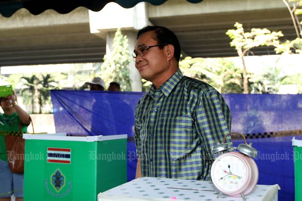 Then army chief Gen Prayut Chan-o-cha casts a ballot in the Feb 2, 2014 general election in Bangkok. The poll was later nullified following a Constitutional Court ruling. (Bangkok Post file photo)
