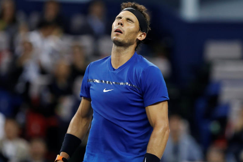 Rafael Nadal reacts during the match against Roger Federer in Shanghai on Sunday. (Reuters photo) Rafael Nadal reacts during the match against Roger Federer in Shanghai on Sunday. (Reuters photo)