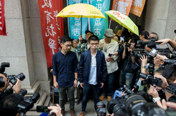 Demosisto leader Joshua Wong (centre-right) and disqualified lawmaker Nathan Law (centre-left) speak to reporters outside of the Court of Final Appeal in Hong Kong, China, on Tuesday. (EPA photo) Demosisto leader Joshua Wong (centre-right) and disqualified lawmaker Nathan Law (centre-left) speak to reporters outside of the Court of Final Appeal in Hong Kong, China, on Tuesday. (EPA photo)