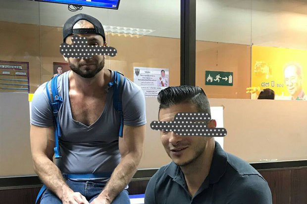 A photo released by the Immigration Bureau shows two American men arrested at Don Mueang airport, Bangkok, Tuesday night. On Wednesday Bangkok police prepared more severe charges in relation to their posted bare-butts photos taken at the well-known Temple of Dawn.