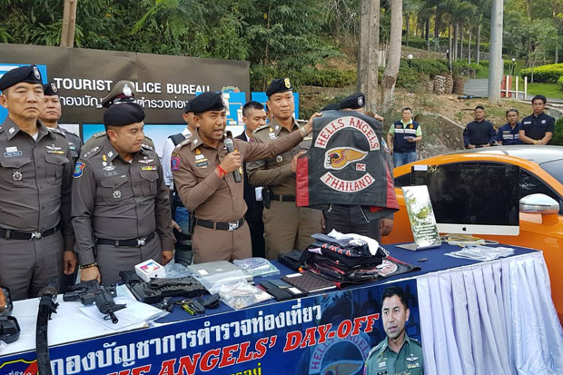 Pol Maj Gen Surachet Hakpal holds a Hells Angels jacket during a press conference in Pattaya on Wednesday. (Photo by Chaiyot Pupattanapong)