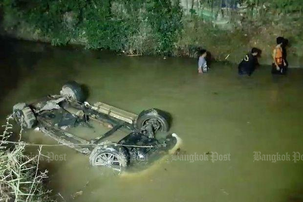 The pickup truck is seen in a roadside ditch following a road chase in the early hours of Friday. (Photo by Sonthanaporn Inchan)