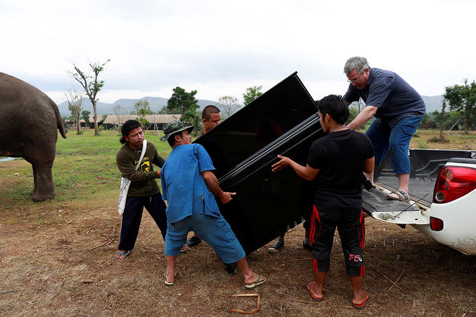 British volunteer Paul Barton unloads his piano before he plays for sick, abused, retired and rescued elephants in sanctuary along Thailand-Myanmar border in Kanchanaburi, Thailand, December 9, 2018. Paul has been playing piano for elephants as a volunteer for almost ten years. Picture taken December 9, 2018. — Reuters