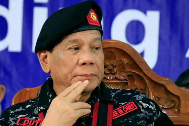 Philippine President Rodrigo Duterte, wearing a military uniform, gestures as he attends the 67th founding anniversary of the First Scout Ranger regiment in San Miguel town, Bulacan province, north of Manila, Philippines Nov 24, 2017. (Reuters photo) Philippine President Rodrigo Duterte, wearing a military uniform, gestures as he attends the 67th founding anniversary of the First Scout Ranger regiment in San Miguel town, Bulacan province, north of Manila, Philippines Nov 24, 2017. (Reuters photo)