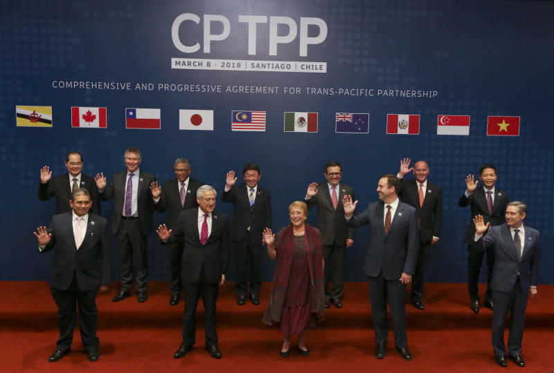 Ministers of the Comprehensive and Progressive Agreement for Trans-Pacific Partnership pose for an official photo prior the signing ceremony in Santiago, Chile, on Thursday. (AP photo)