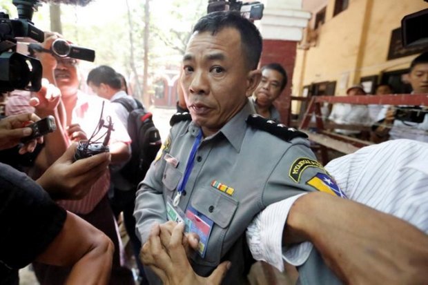 Myanmar jails cop who said reporters were framed