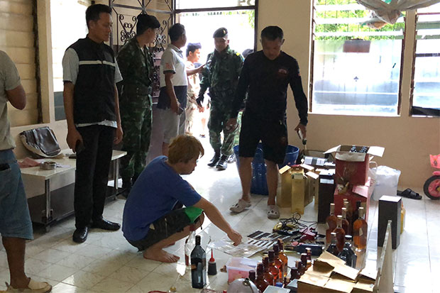 Malaysian held in fake-liquor case